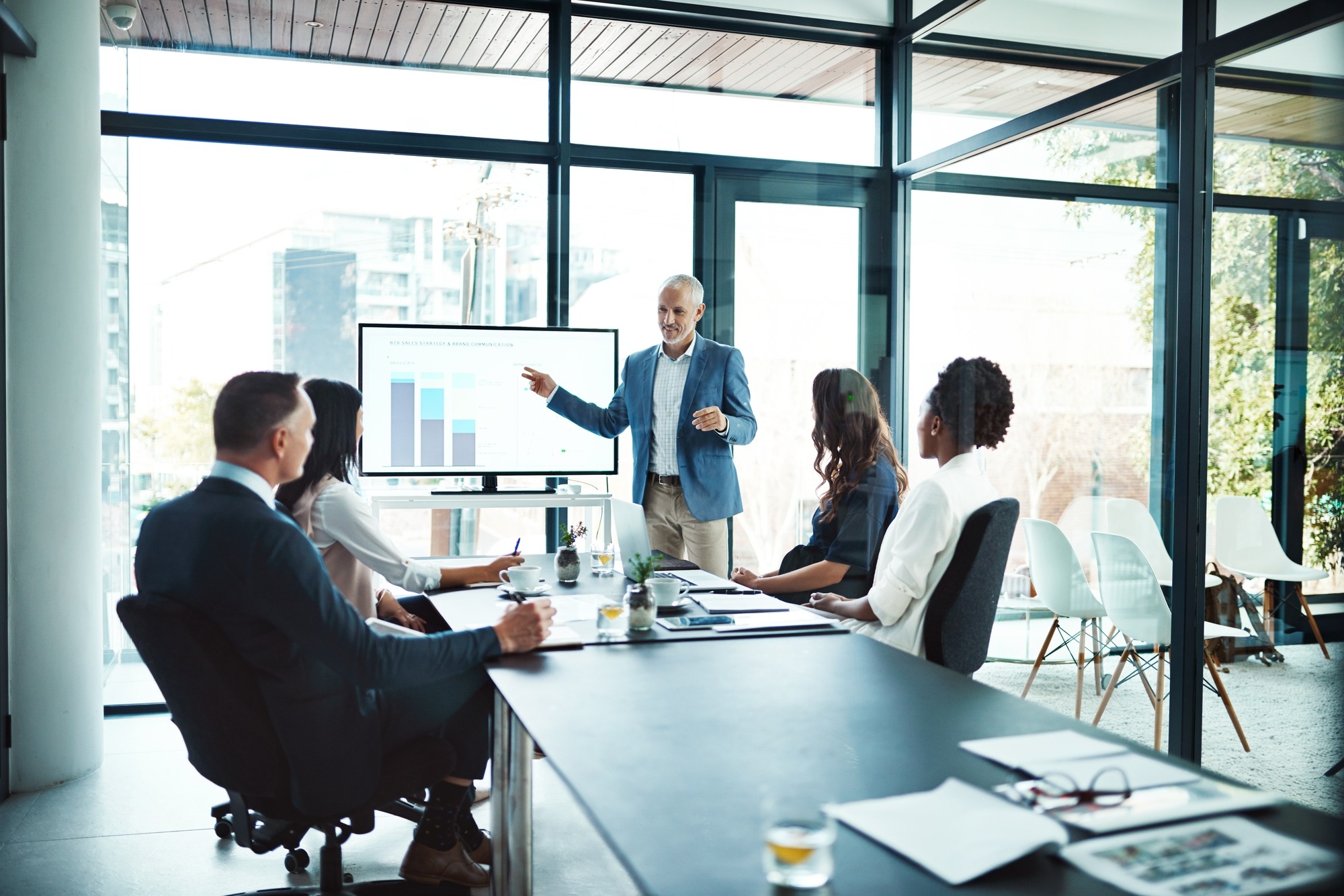 Business, charts and man with presentation, office and conversation for project